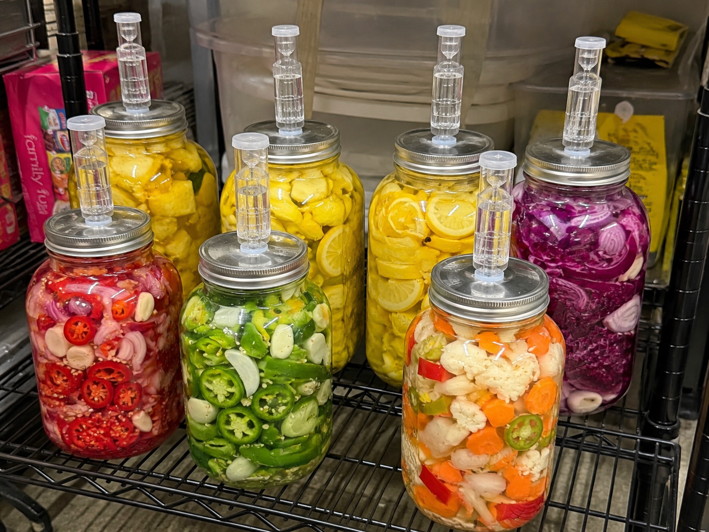 Jars of pickled vegetables on a cooling rack